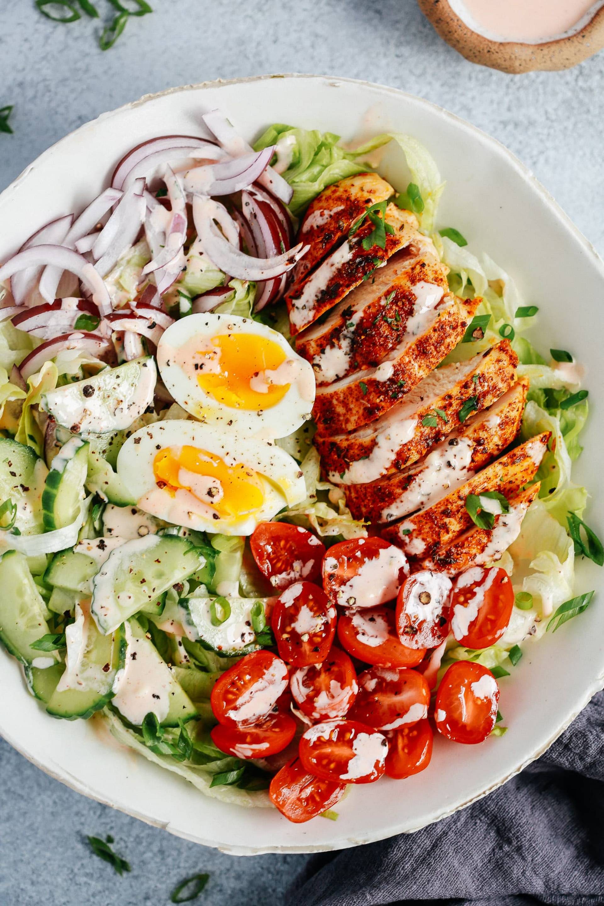 S.L.-Roasted Turkey Salad w/Mixed Greens, Cucumber, Rainbow Tomato, Eggs, Sharp Cheddar, Red Onions, Dried Cranberry & Vidalia Onion Vinaigrette.