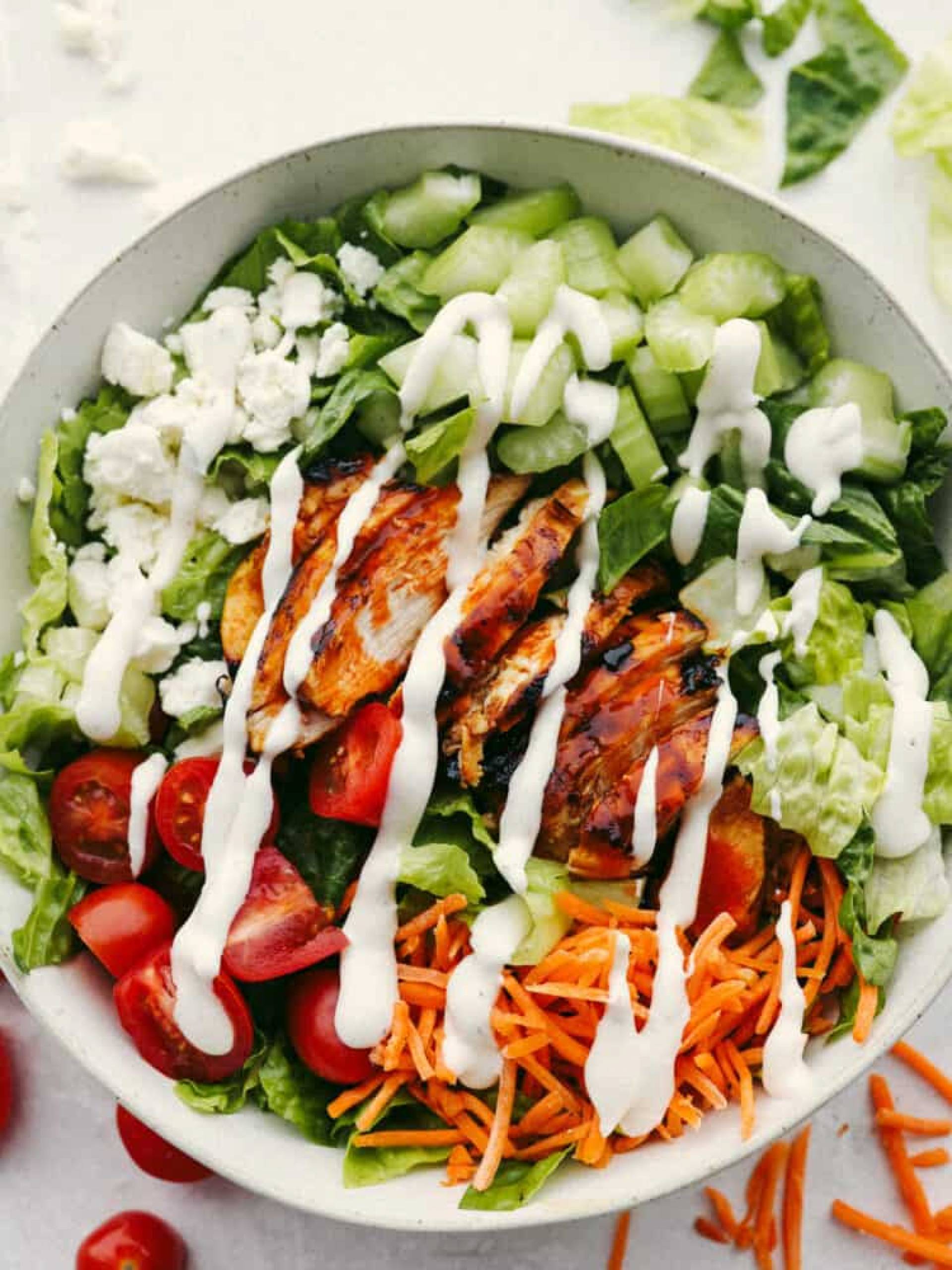 KETO-Grill Chicken Salad w/Mixed Greens, Tomato, Almonds, Green Onions, Blue Cheese, Spiced Walnuts & Ranch Vinaigrette.